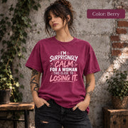 Color Berry shirt featuring the “I’m Surprisingly Calm” graphic in pink and white with a playful sarcastic feel.
