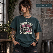 Blue Spruce Comfort Colors tee showcasing the alien graphic with positive message, floral accents, and celestial motifs.