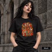 Black unisex shirt showcasing the colorful Thanksgiving graphic with turkey, plaid accents, leaves, and pumpkins.