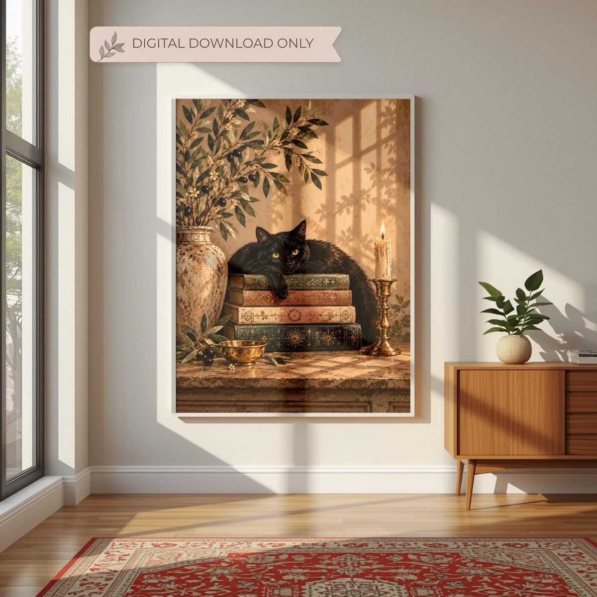 Vintage botanical cat poster displayed in a wood frame on a low console with neutral decor. The golden-eyed black cat, stacked books, and olive foliage complement a warm, cottage-inspired interior.