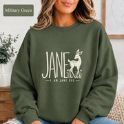 Military Green crewneck featuring the meaningful Jane Doe graphic with cream lettering and a graceful deer motif.