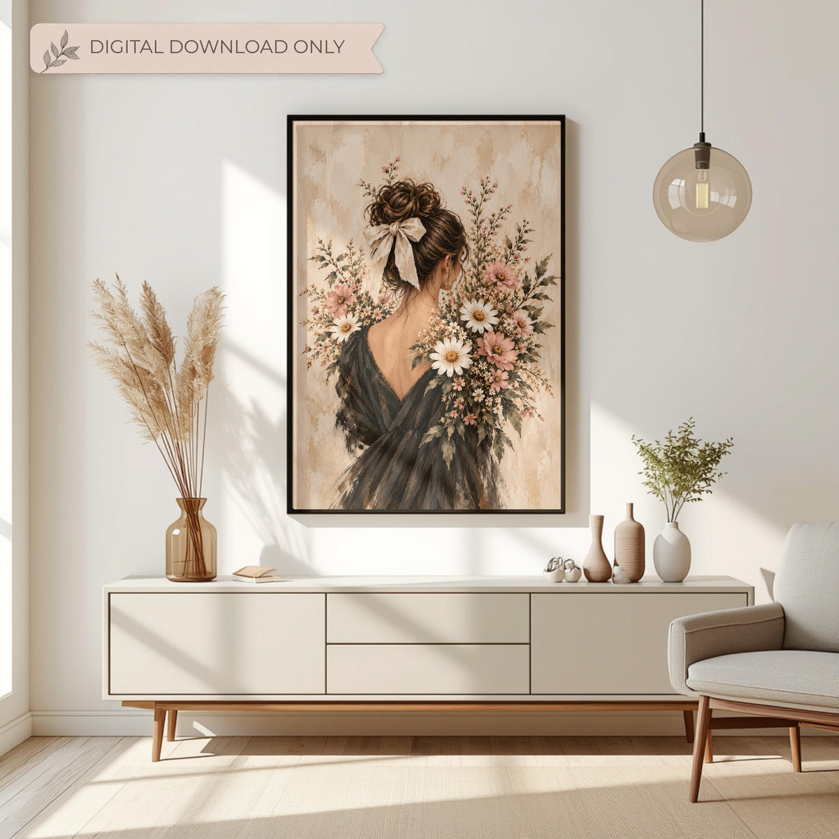 Feminine coquette wall art displayed above a cream console table with dried botanical arrangements. The portrait features a brunette woman in a flowing black dress surrounded by pink and white wildflowers.