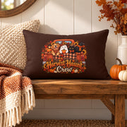 Harvest Haunt Crew lumbar pillow styled on a rustic wood bench with cream textured pillow, fall throw blanket, pumpkins, and autumn foliage.