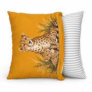 Side-view mockup of the mustard yellow cushion showing the printed cheetah design and striped backing fabric.
