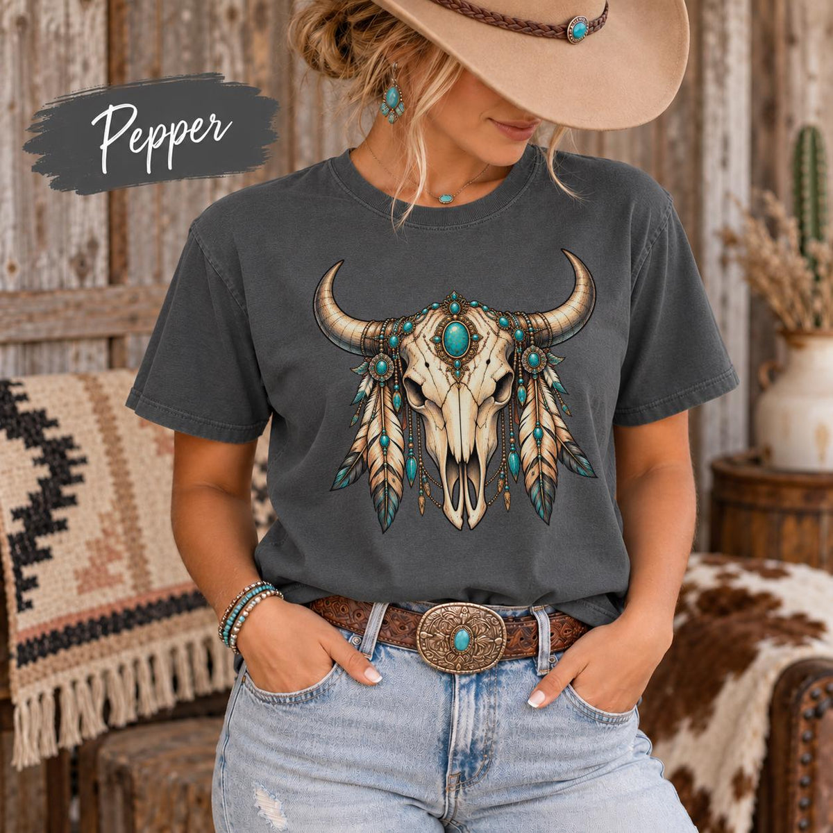 Pepper Comfort Colors 1717 T-shirt featuring an ornate bull skull with turquoise-inspired stones, feathers, beads, and detailed Western accents.