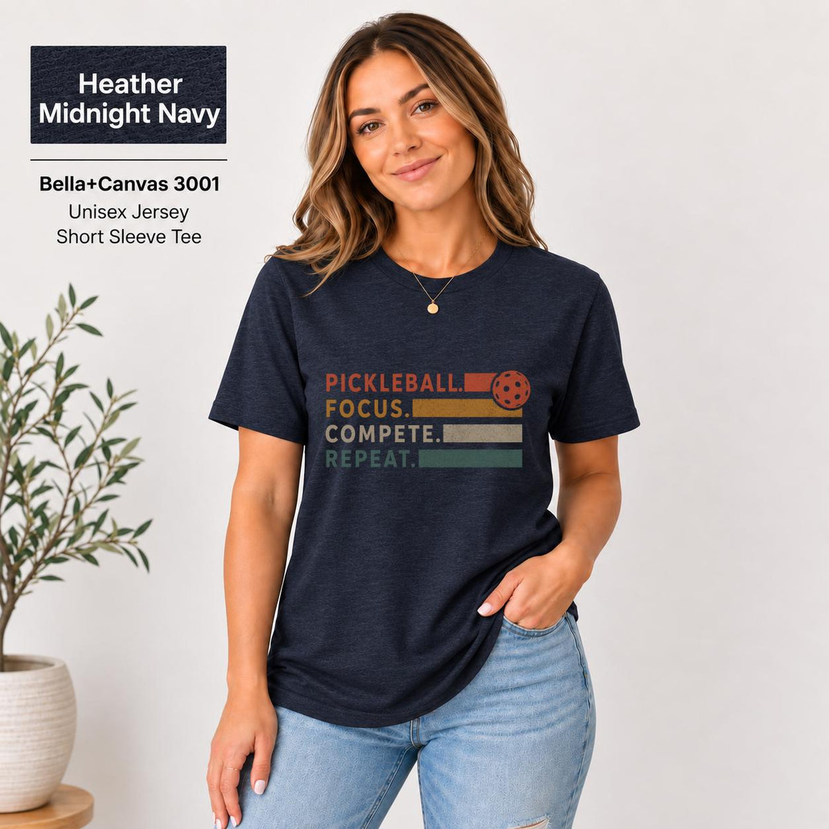 Heather Midnight Navy Bella+Canvas tee featuring the statement artwork with orange-red typography on a classic unisex shirt.