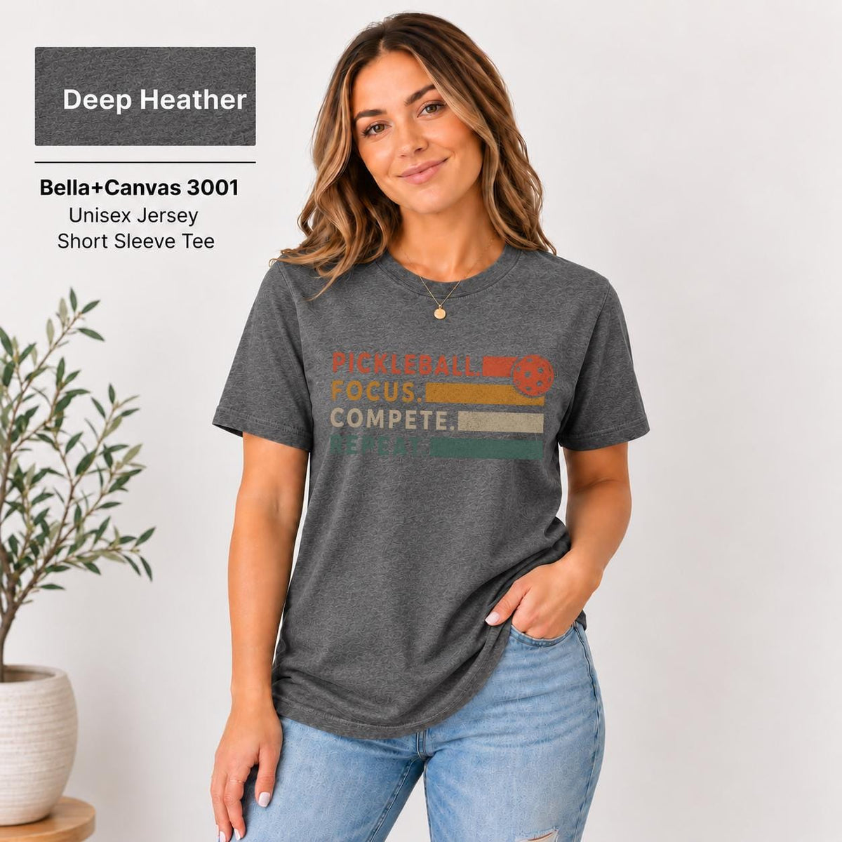Deep Heather T-shirt showcasing the typography graphic in contrasting warm colors.