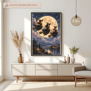 Framed witchy fantasy wall art displayed above a cream console table with dried botanical arrangements. The artwork features three witches flying on broomsticks across a golden full moon above an enchanted castle and moonlit river.