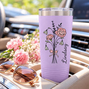 Light purple tumbler mockup displaying the same custom flower design with black line art, soft pink blossoms, and personalized name.