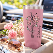 Light pink 20oz insulated cup featuring the floral bouquet and custom vertical lettering for a feminine everyday drinkware look.
