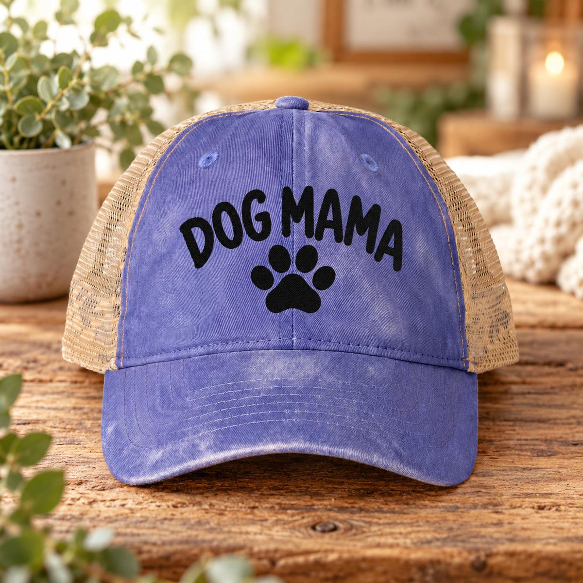 Violet women’s washed mesh-back hat featuring the black Dog Mama embroidery with a centered paw print.