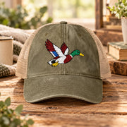 Olive green women’s mesh-back hat featuring the colorful flying duck embroidery and relaxed outdoor styling.