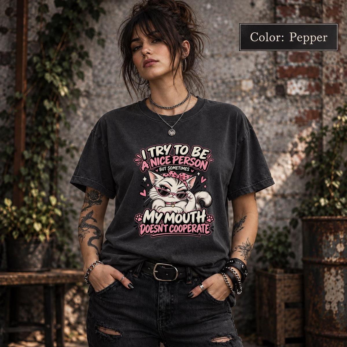 Pepper Comfort Colors shirt featuring the funny cat quote design with pink, cream, and white details on a dark vintage-style tee.