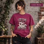 Berry Comfort Colors T-shirt displaying the sassy cat artwork with bold pink lettering and playful retro accents.