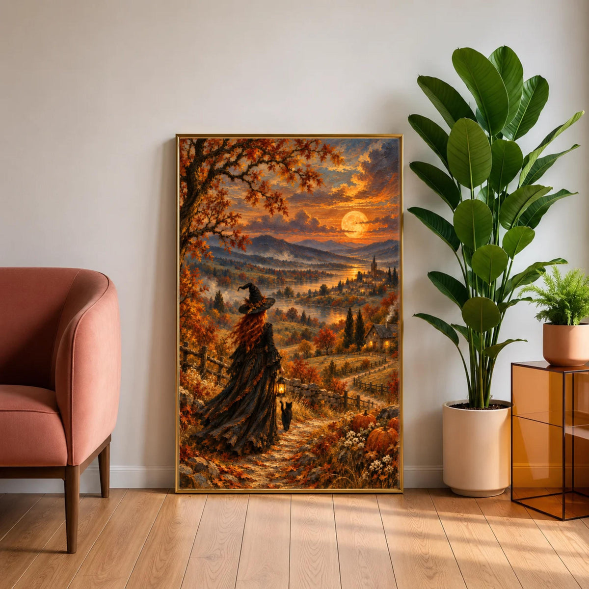 Framed mystical autumn landscape displayed above a neatly made cream bed with soft neutral bedding. The vintage-inspired witch painting features a glowing harvest moon, black cat, winding path, and rich orange foliage.