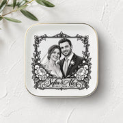 Personalized wedding keepsake dish shown on a light textured background with greenery, featuring a custom black-and-white bride and groom portrait.