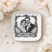 Personalized wedding ring dish styled with pearls, flowers, and soft ribbon, featuring a custom couple portrait and elegant gold-edged ceramic finish.