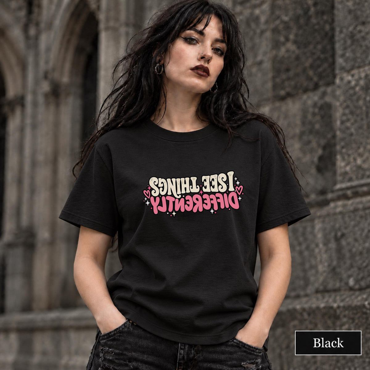 Black unisex T-shirt featuring the “Same Girl, Bigger Goals, Stronger Coffee, Less Bullshit Than Before” motivational graphic in cream and pink lettering.