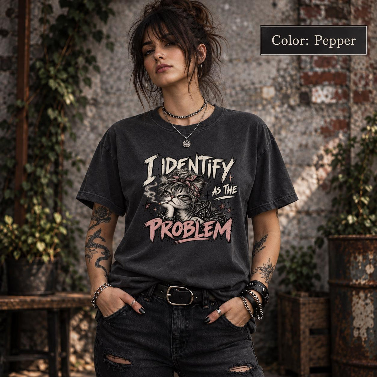 Pepper Comfort Colors shirt featuring the “I Identify as the Problem” cat design in a vintage-style dark neutral shade.
