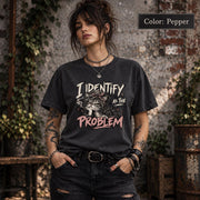 Pepper Comfort Colors shirt featuring the “I Identify as the Problem” cat design in a vintage-style dark neutral shade.
