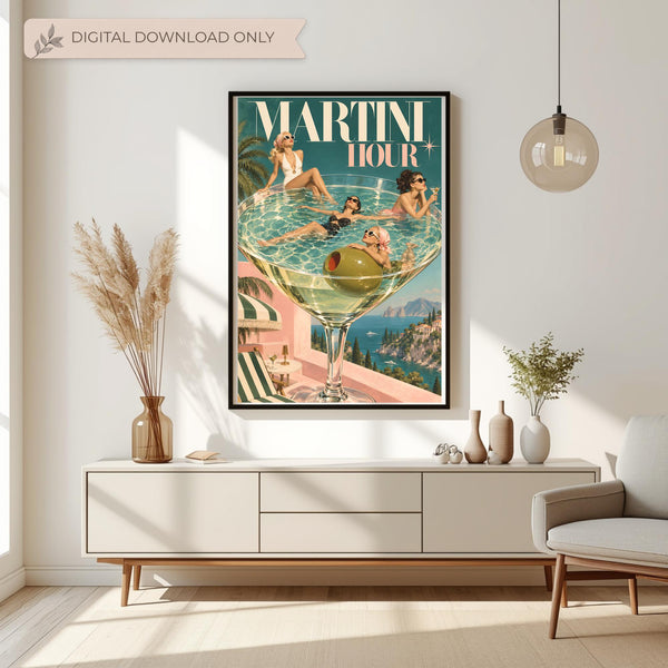 Martini Hour retro cocktail wall art displayed above a cream console table with dried botanical arrangements. The colourful poster features four glamorous women lounging inside an oversized martini glass overlooking the Italian Riviera coastline.
