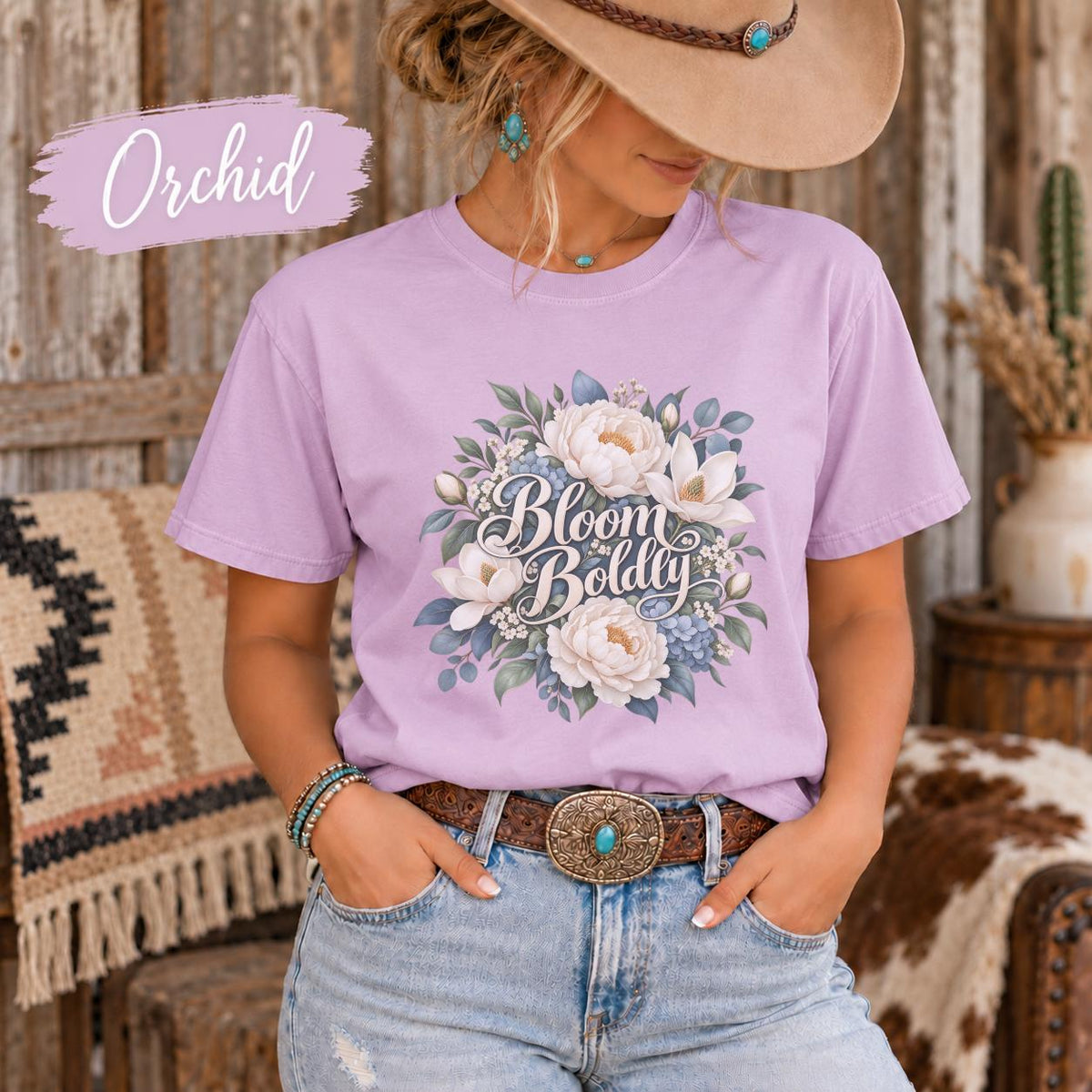Orchid Comfort Colors shirt featuring the same botanical design with soft florals and leafy accents on a pastel purple tee.