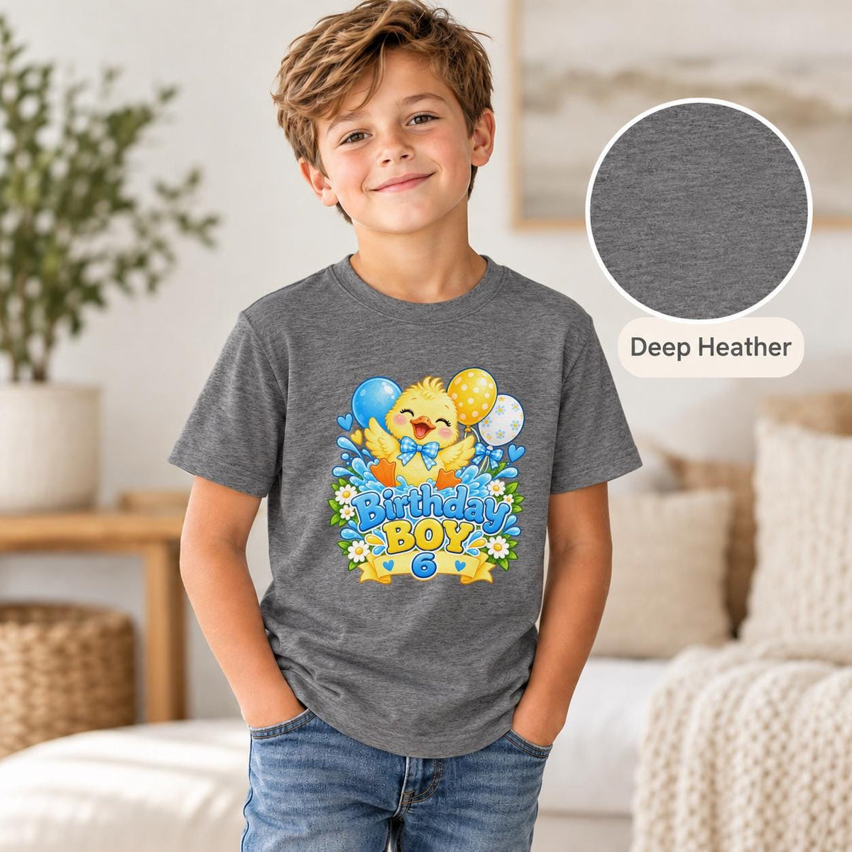 Deep Heather youth shirt displaying the cheerful duckling birthday artwork with colorful party accents.