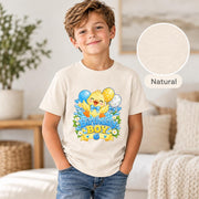 Natural Bella+Canvas 3001Y youth T-shirt featuring a colorful birthday duckling design with balloons, daisies, and personalized age wording.