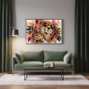 Digital leopard print displayed above a green sofa in a moody modern living room with dark walls.
