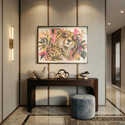 Digital leopard wall art displayed in a black frame above a console table in a modern neutral entryway.