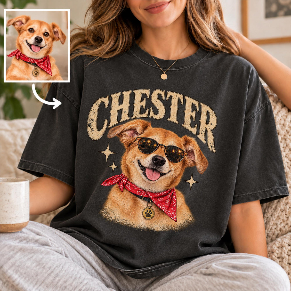 Woman wearing a charcoal T-shirt featuring Chester's personalized vintage dog portrait design, with a small reference photo of the dog showing how a pet image becomes custom shirt artwork.