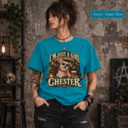 Woman wearing a topaz blue personalized dog photo shirt displaying the custom Chester design with golden lettering, retro bar scene, and a playful pet portrait.