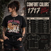 Comfort Colors 1717 unisex T-shirt size chart beside a woman wearing a black Just a Girl Who Loves Dogs graphic tee, showing garment measurements and sizing information.