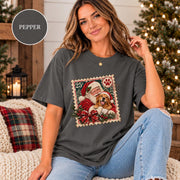 Pepper Comfort Colors 1717 tee displaying the custom Christmas pet artwork with Santa and dog in a distressed retro stamp design.