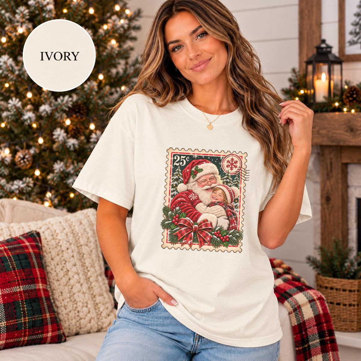 Ivory Comfort Colors 1717 T-shirt featuring a customizable vintage Christmas postage-stamp design with Santa holding a child, snowy trees, holly berries, plaid bow, and personalized photo artwork.