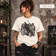 Ivory Comfort Colors shirt featuring the dark multi-cat graphic with black, cream, and red details on a light neutral background.