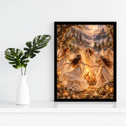 Framed enchanted forest poster displayed against a white wall beside a small green plant. The artwork features five women dancing around a magical bonfire beneath a golden moon and distant castle.