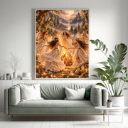 Enchanted forest wall art displayed above a sage green sofa surrounded by houseplants. The fantasy artwork features five graceful women gathered around a bonfire beneath a glowing moon and starry sky.