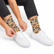 Retro dog socks paired with white sneakers and rolled black jeans. Fun novelty crew socks feature dogs in sunglasses, hamburgers, hot dogs, stars, and cheerful retro illustrations for everyday casual wear.