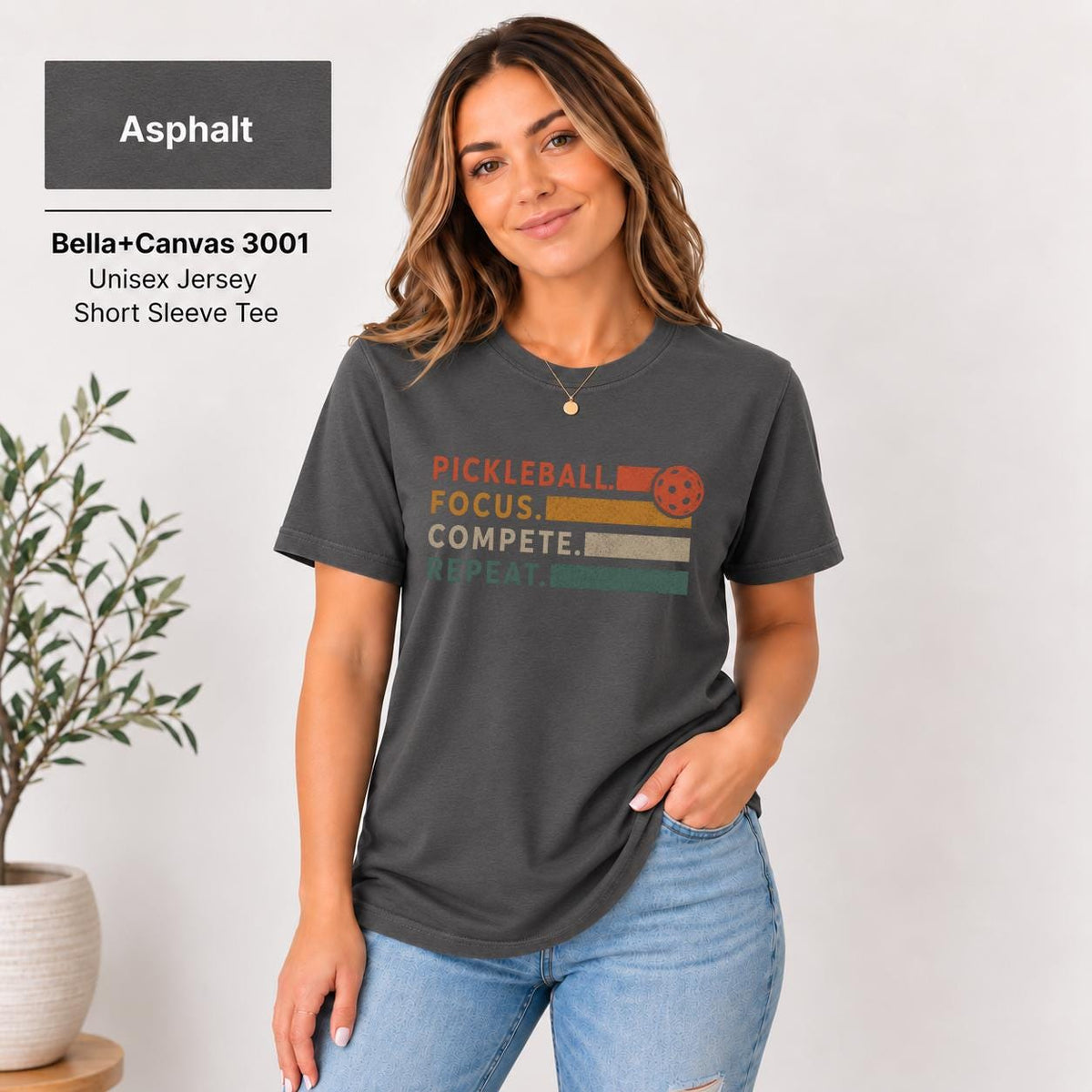 Asphalt shirt featuring the minimalist statement design with warm orange and darker lettering.