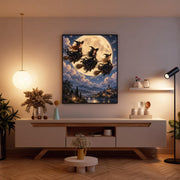 Moonlit fantasy poster displayed above a wooden console table with soft decorative lighting. A glowing golden moon, flying witches, and illuminated Gothic castle create a mystical focal point.