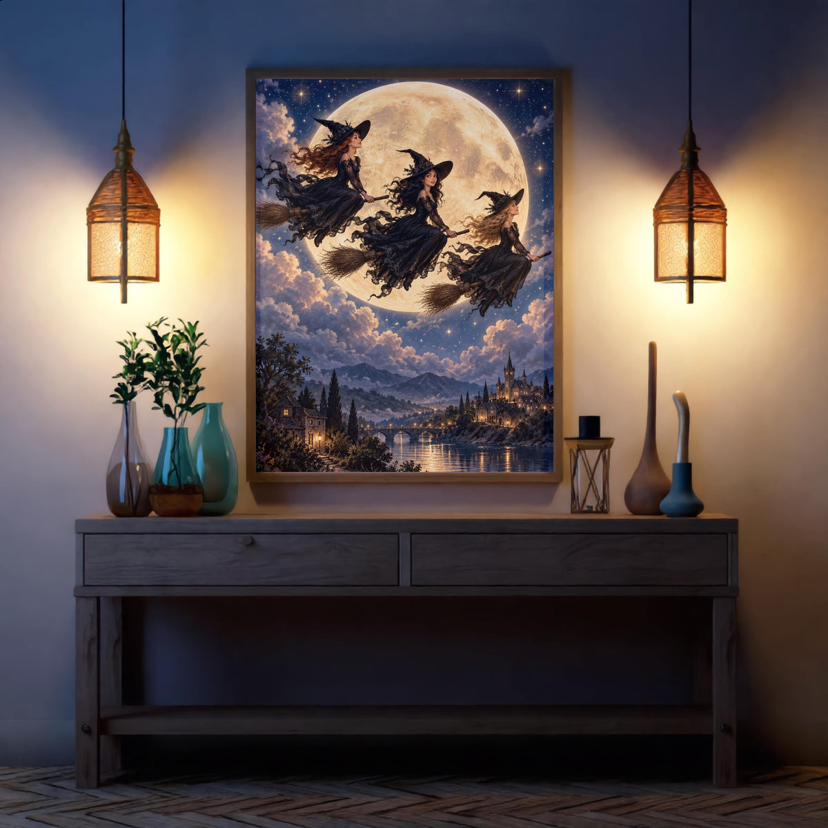 Mystical witch wall art displayed above a dark console table between two warm wall sconces. The celestial scene features flowing black gowns, golden moonlight, a star-filled sky, and an illuminated castle.