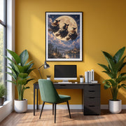 Framed fantasy witch poster displayed above a wooden desk with a mustard-yellow chair and green plants. The dramatic moonlit artwork features three witches soaring above a magical castle landscape.