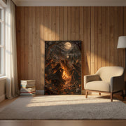 Framed dark fantasy artwork displayed on a wood-paneled wall beside a cream reading chair and floor lamp. Five witches dance around a bright bonfire beneath a mysterious golden moon.