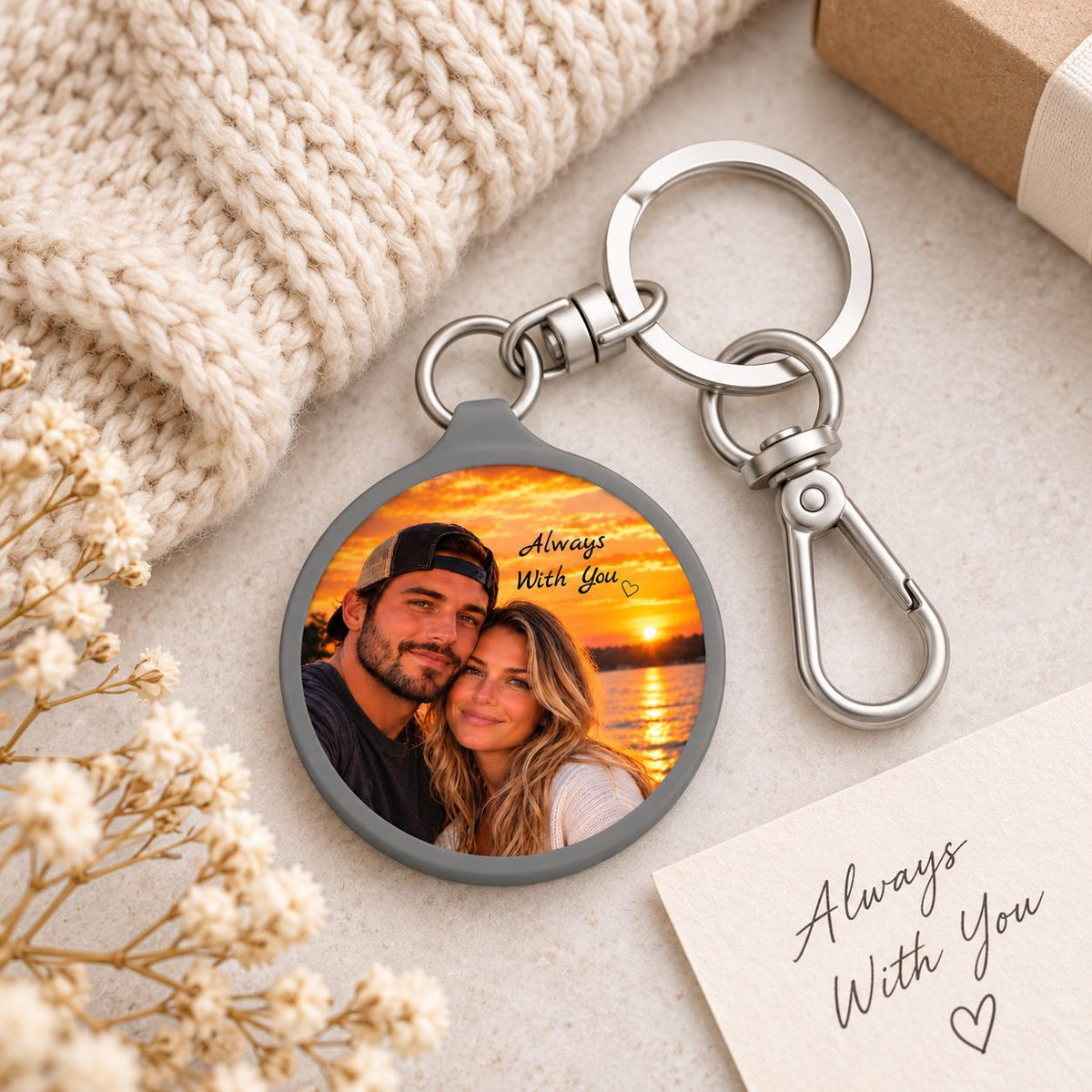 Personalized couple photo keychain styled on a cozy knit background with a small message card and silver clip hardware.