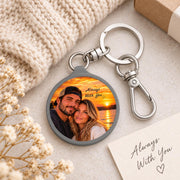 Personalized couple photo keychain styled on a cozy knit background with a small message card and silver clip hardware.