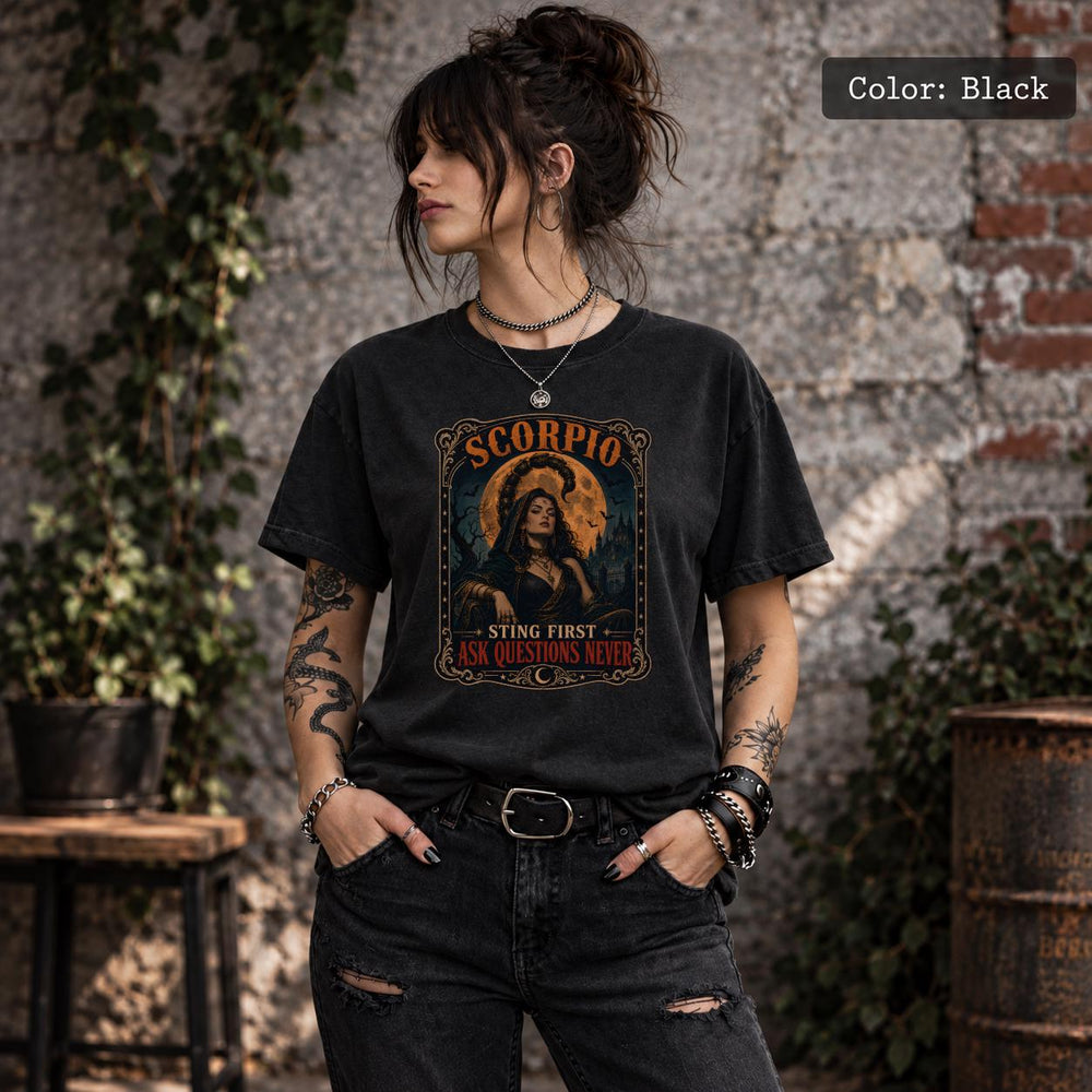 Black Comfort Colors 1717 T-shirt featuring a vintage Scorpio zodiac graphic with a dark feminine figure, scorpion, glowing moon, and gothic-inspired artwork.