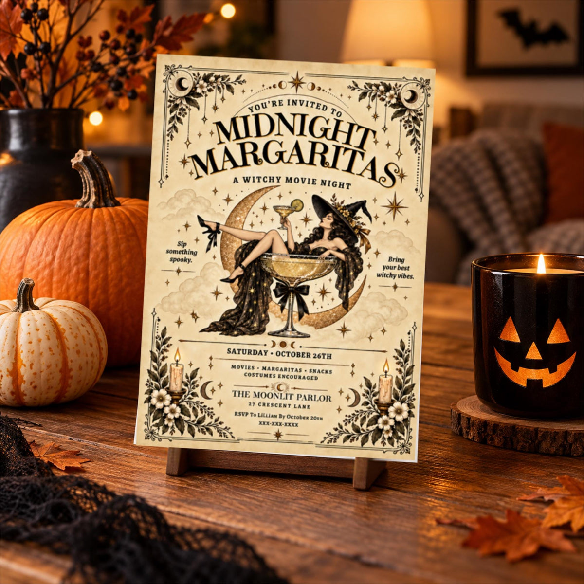 Witchy movie night invitation displayed on a rustic wooden tabletop beside a glowing jack-o'-lantern candle, pumpkins, and autumn decorations. The vintage-inspired party design features a witch relaxing in a margarita glass.