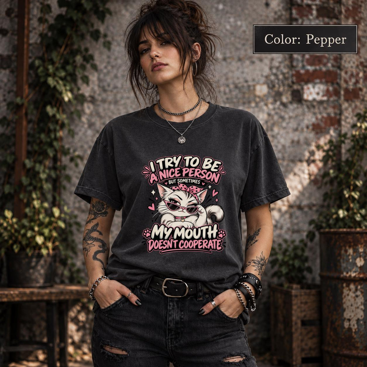 Pepper Comfort Colors shirt featuring the funny cat quote design with pink, cream, and white details on a dark vintage-style tee.