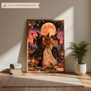 Framed Halloween fantasy artwork resting on a wooden floor against a neutral wall. Three witches wearing celestial-patterned dresses raise their glasses beneath a golden moon in a colourful desert landscape.